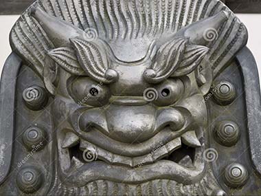 Iron face statue at Tenryuji Temple on Shutterstock.com