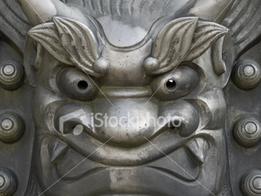 Close-up of iron face statue at Tenryuji Temple on Shutterstock.com