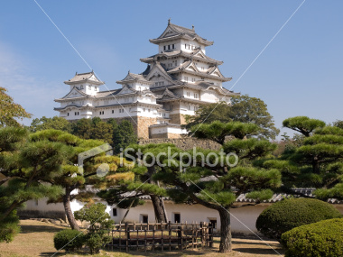 Himeji Castle main tower with bonsai pine trees on Shutterstock.com
